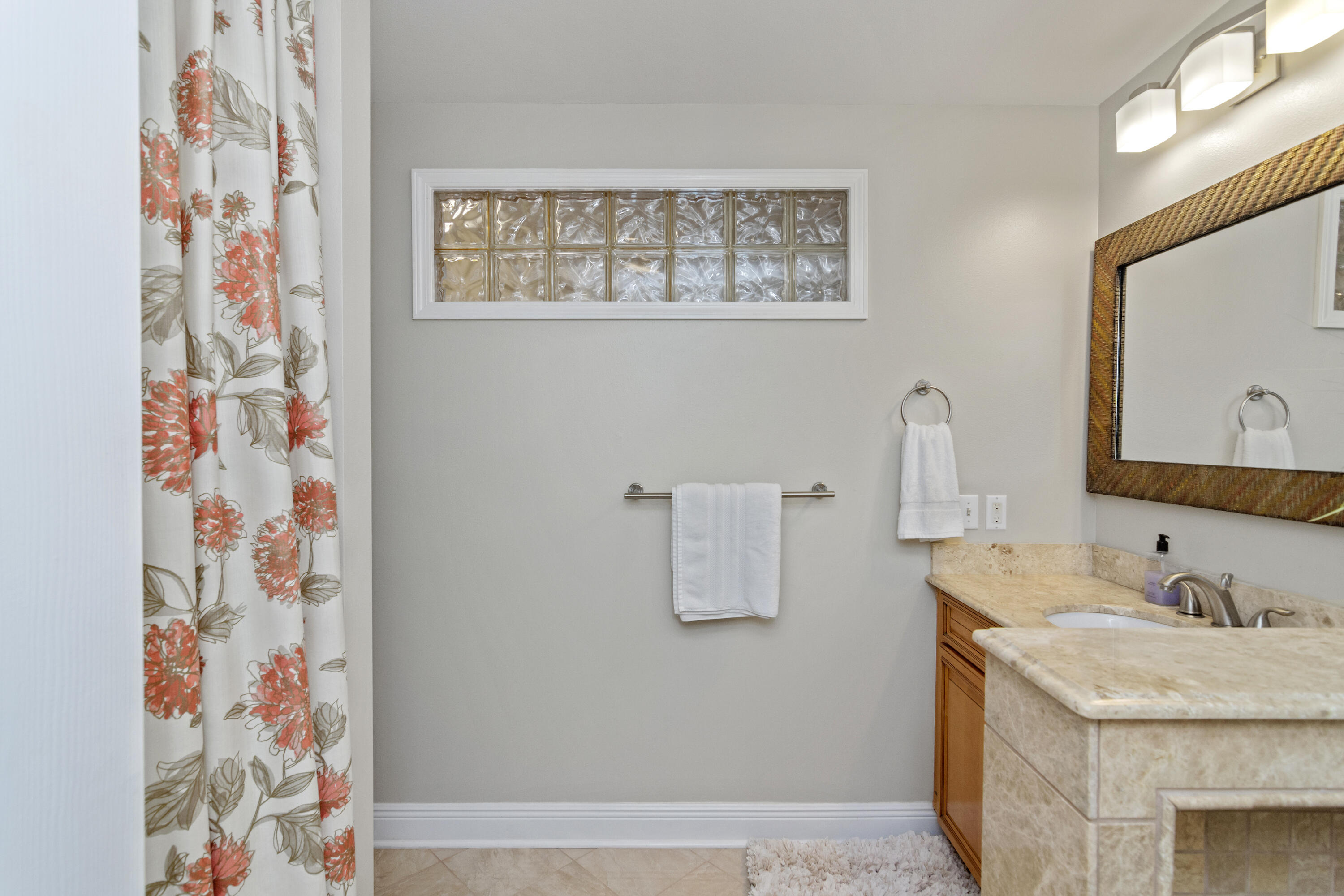 5766 Wildwood Road Crestview, FL 32536 - Photo 33 of 45 a bathroom with a granite countertop sink and a mirror