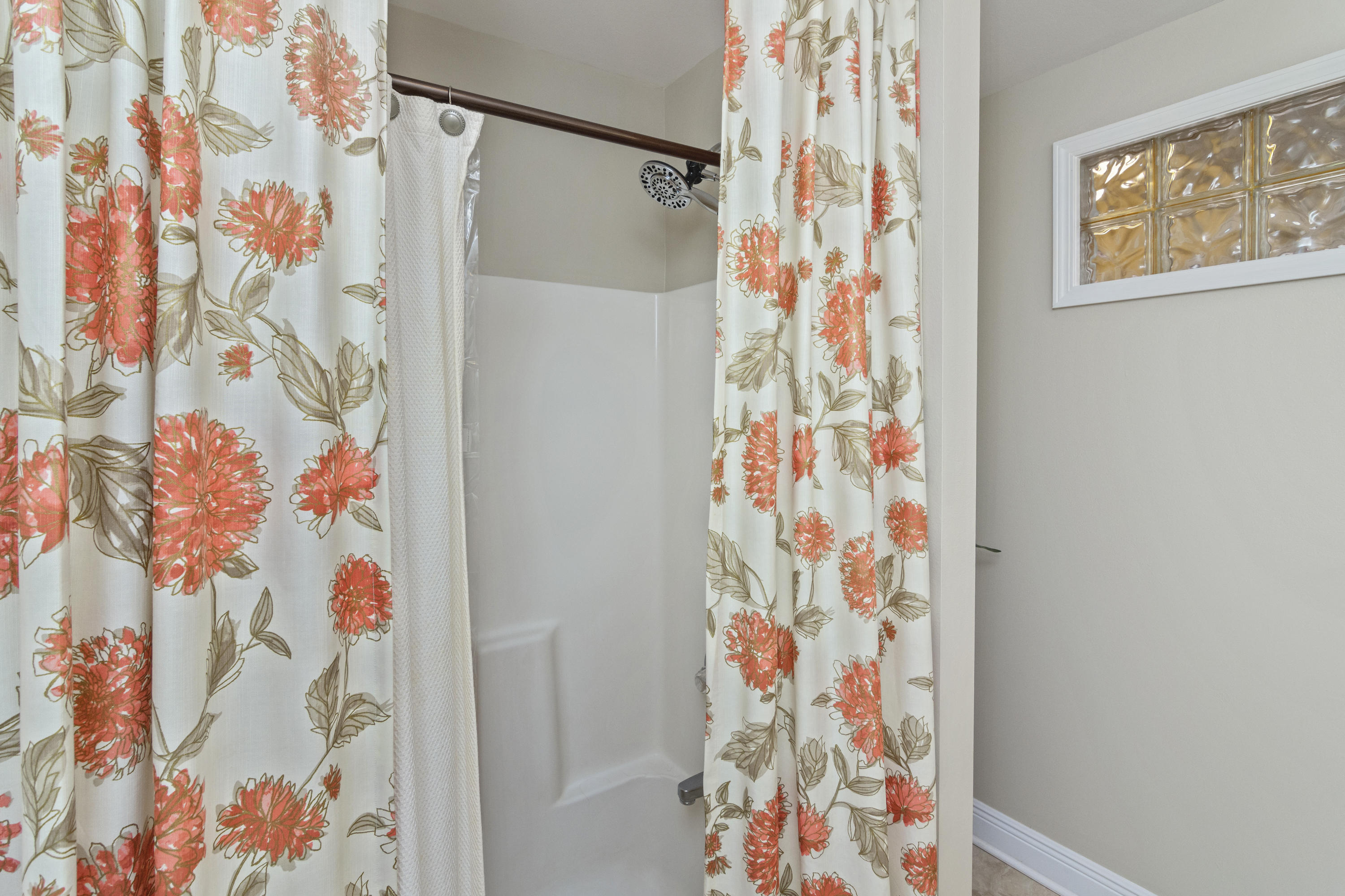 5766 Wildwood Road Crestview, FL 32536 - Photo 34 of 45 a bathroom with a shower curtain