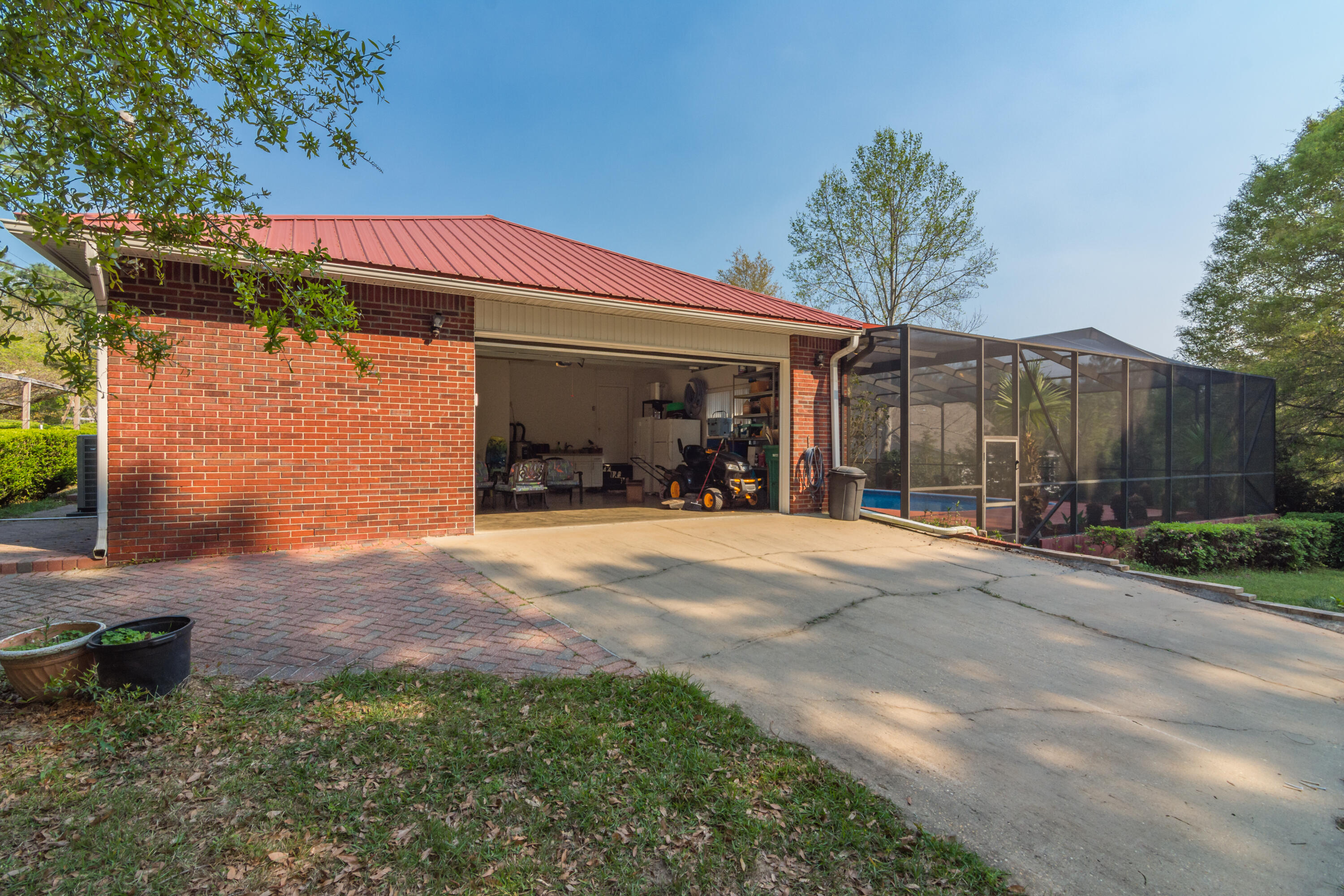 5766 Wildwood Road Crestview, FL 32536 - Photo 37 of 45 a view of a house with backyard and sitting area