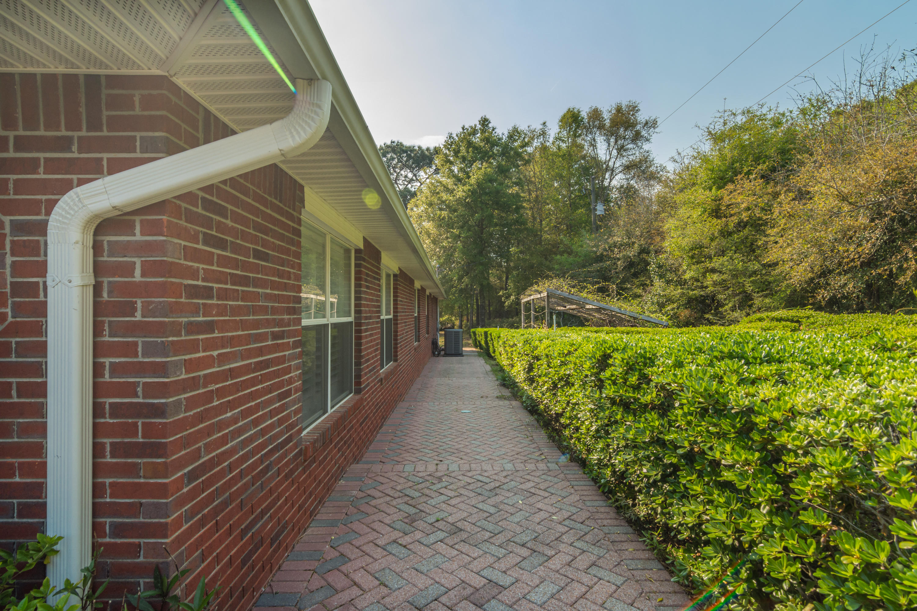 5766 Wildwood Road Crestview, FL 32536 - Photo 38 of 45 a view of a pathway both side of house