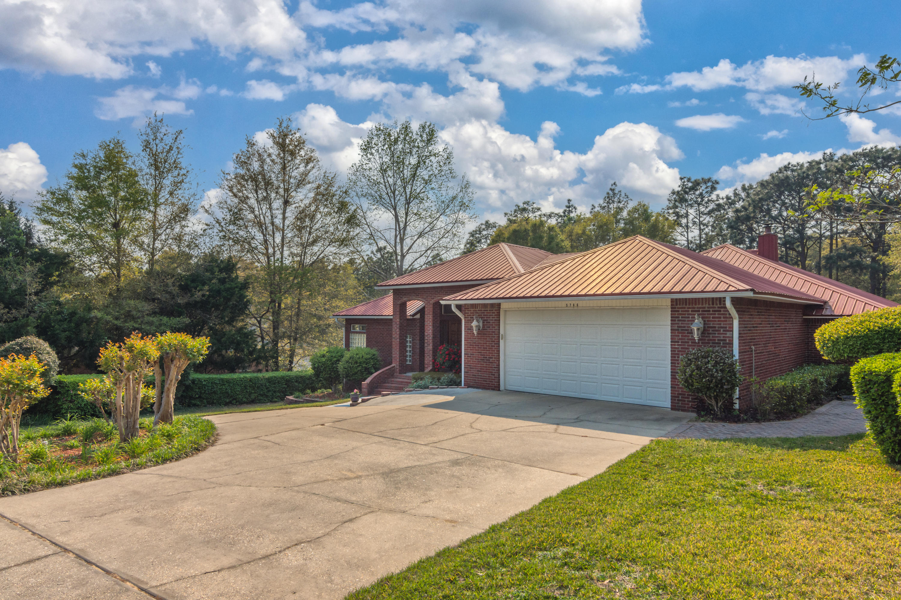5766 Wildwood Road Crestview, FL 32536 - Photo 40 of 45 a front view of a house with garden