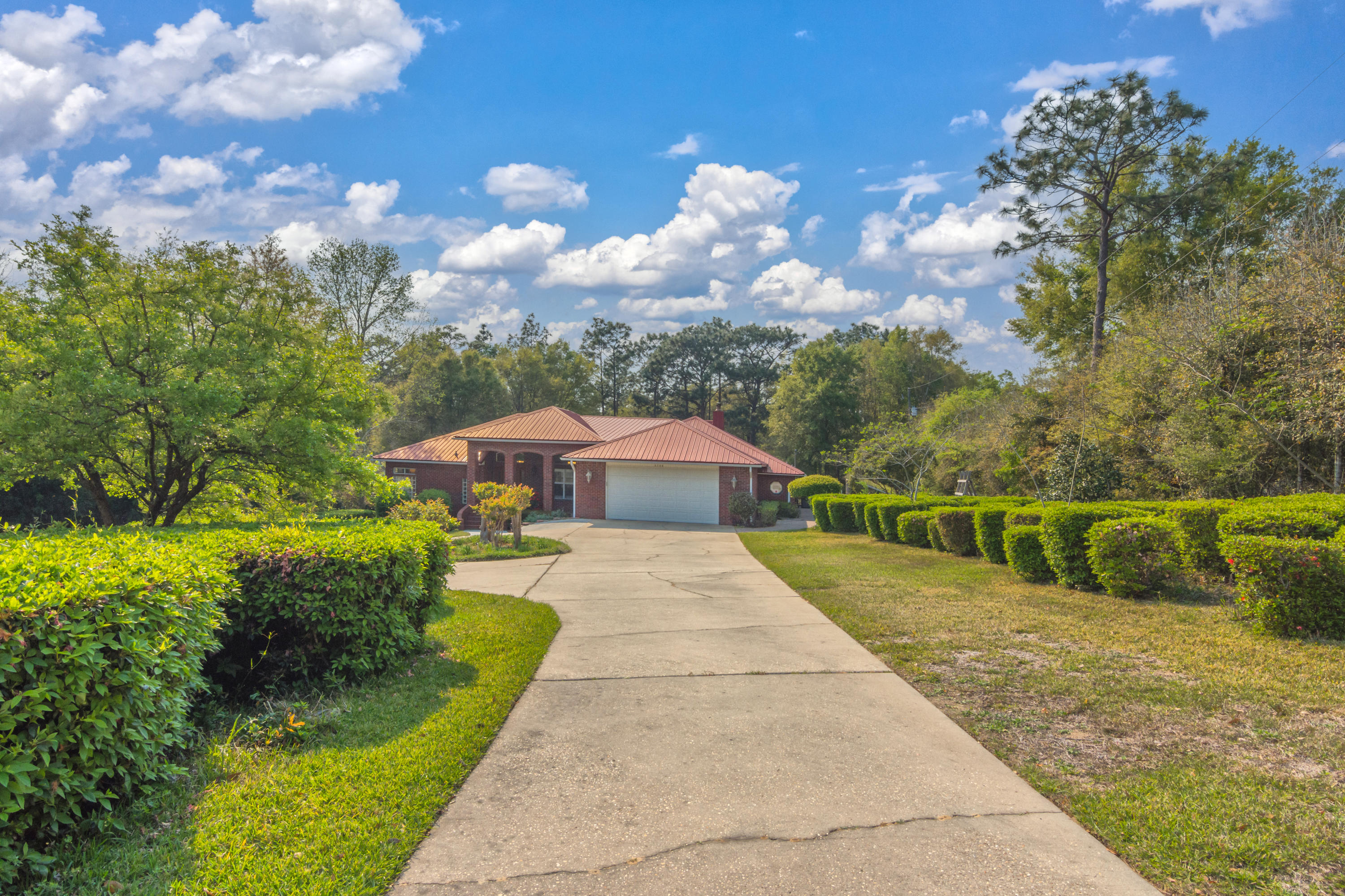 5766 Wildwood Road Crestview, FL 32536 - Photo 41 of 45 a front view of a house with a yard