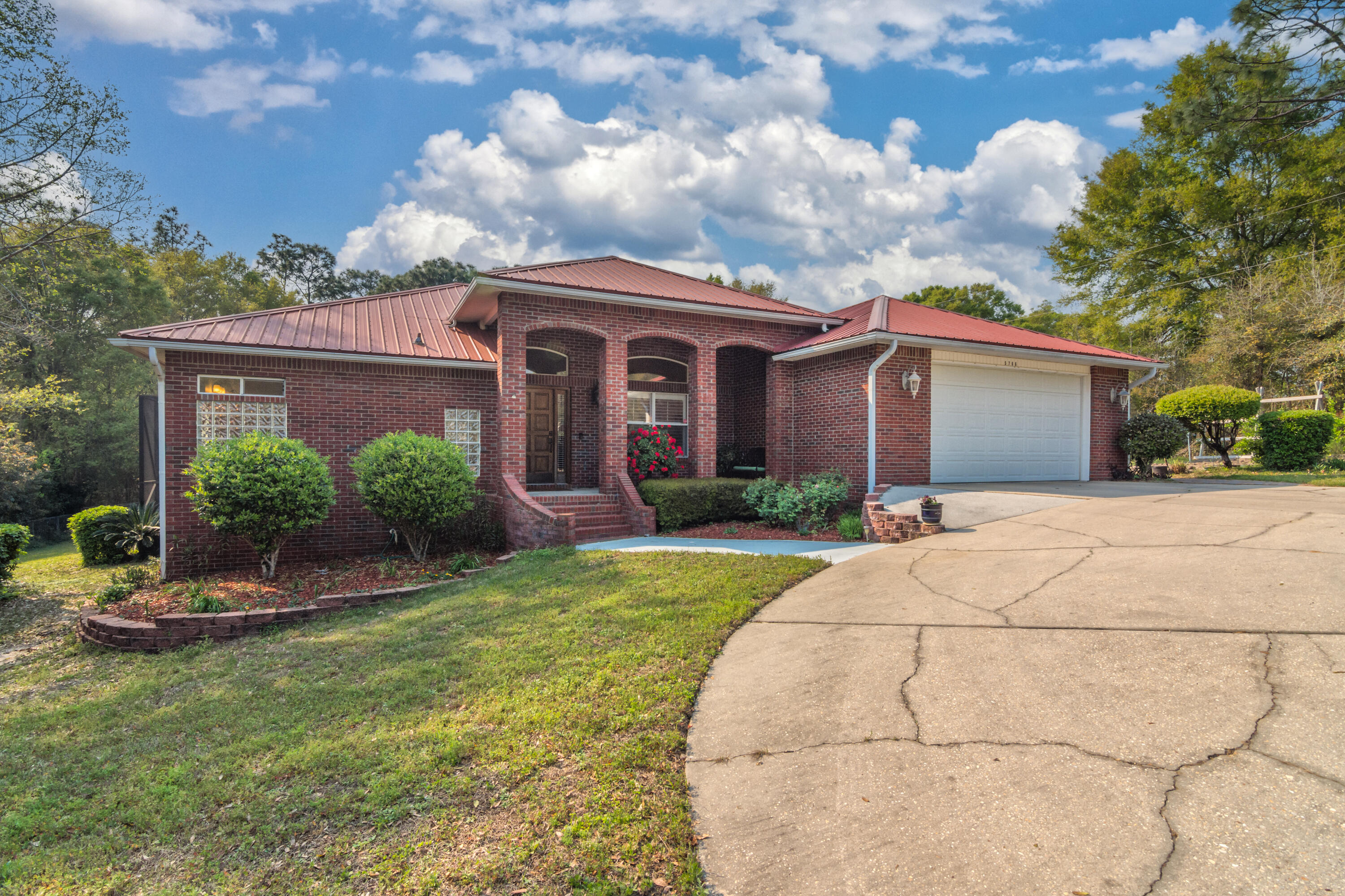 5766 Wildwood Road Crestview, FL 32536 - Photo 42 of 45 a front view of a house with a yard