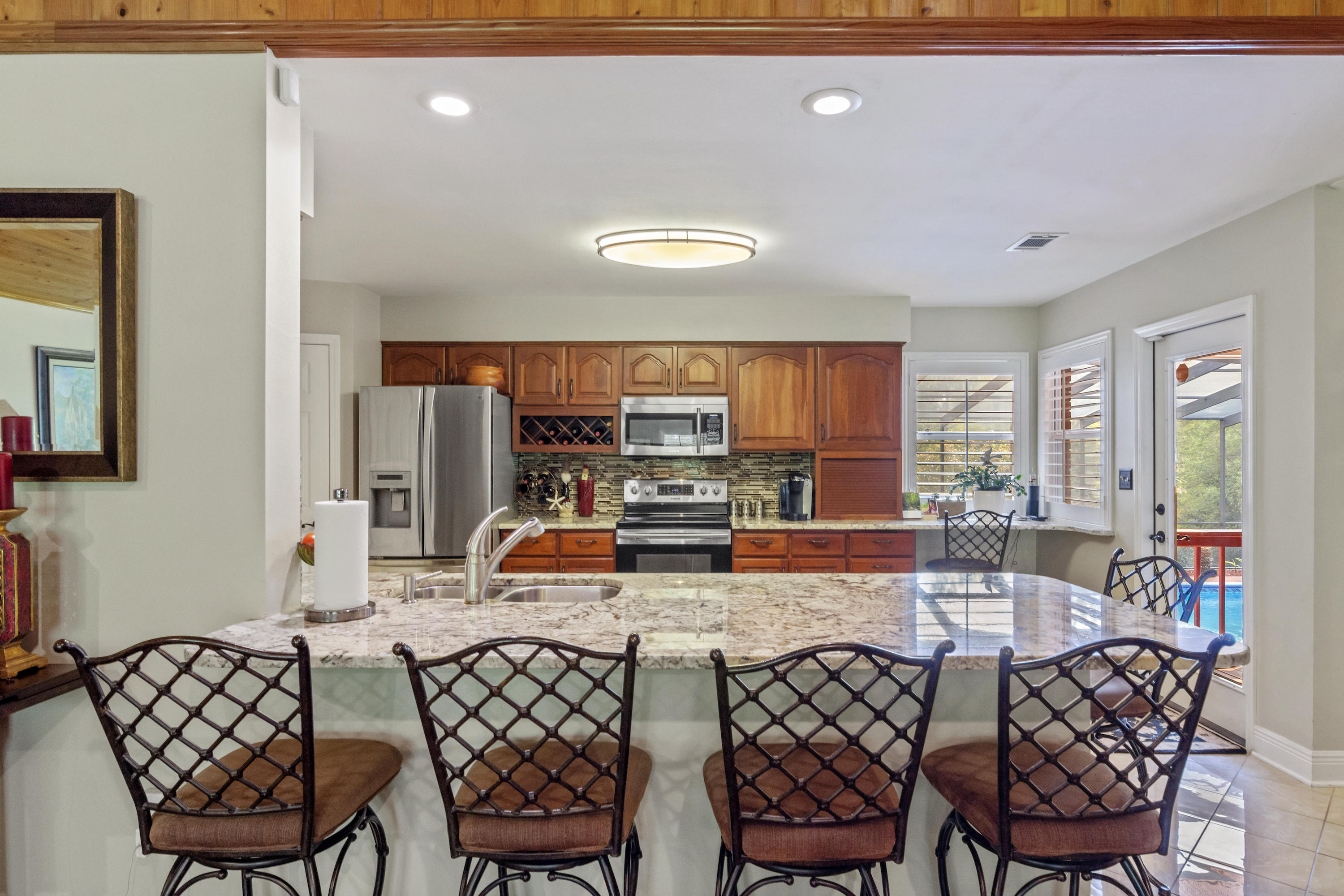 5766 Wildwood Road Crestview, FL 32536 - Photo 6 of 45 a view of a dining room with furniture window and outside view