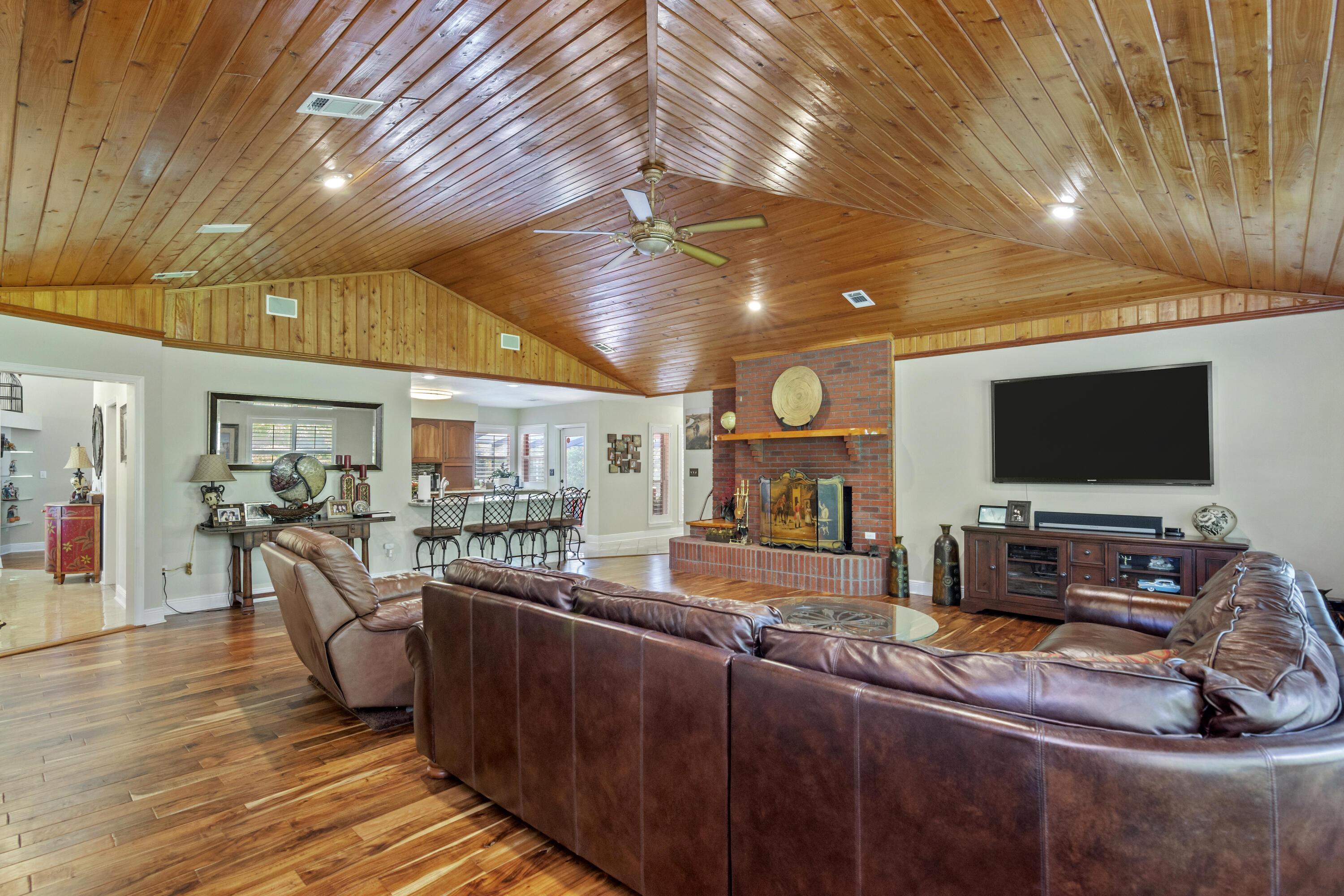5766 Wildwood Road Crestview, FL 32536 - Photo 9 of 45 a living room with furniture and a flat screen tv