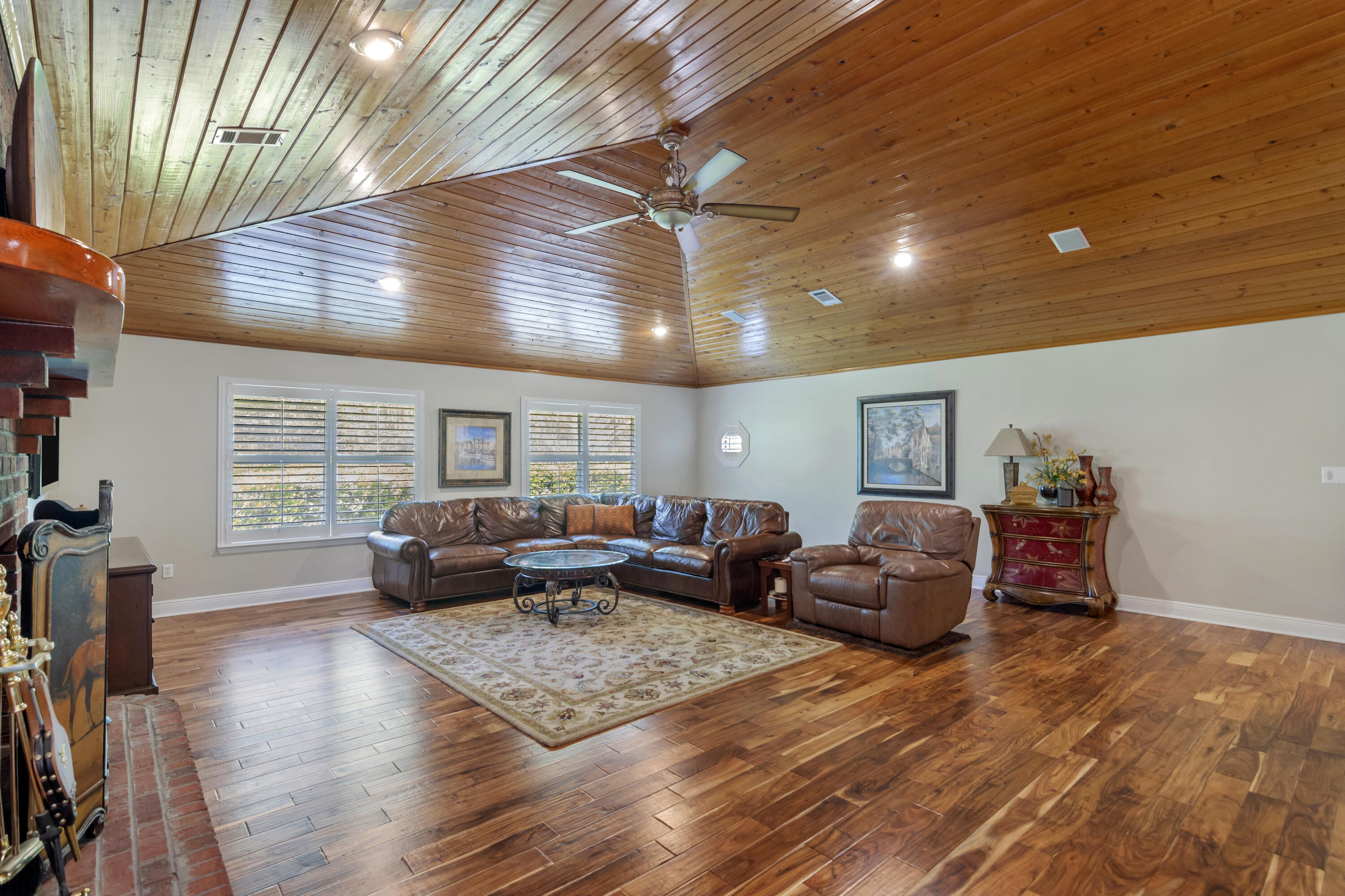 5766 Wildwood Road Crestview, FL 32536 - Photo 10 of 45 a living room with furniture and wooden floor
