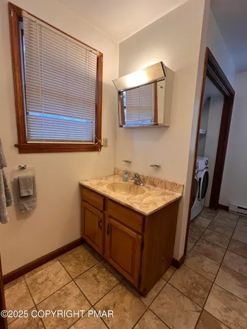 a utility room with a sink a washer and dryer