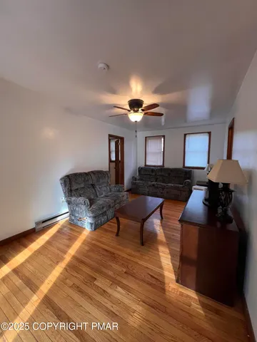 a living room with furniture and a rug