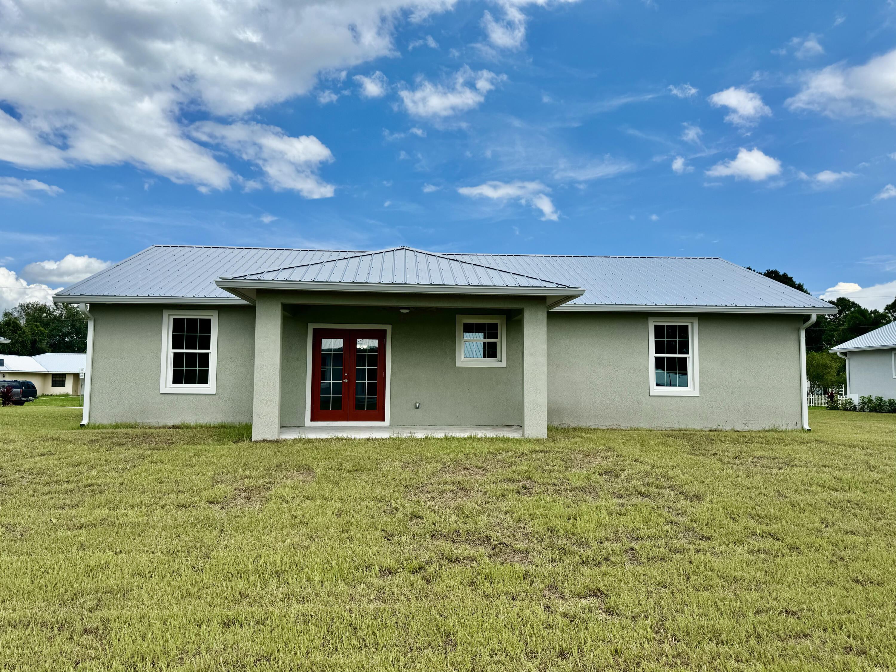 553 Southeast 36th Terrace Okeechobee, FL 34974 - Photo 21 of 21 a house that has a tree in front of it