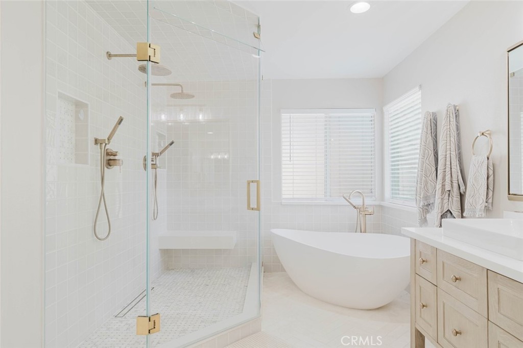 32480 The Old Road Castaic, CA 91384 - Photo 46 of 68 a bathroom with a tub sink and mirror
