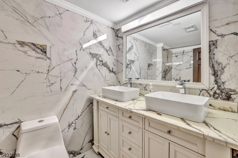 1475 Mt Holly Road, Unit 4 Edgewater Park, NJ 08010 - Photo 13 of 18 a spacious bathroom with double vanity sink a mirror and a toilet