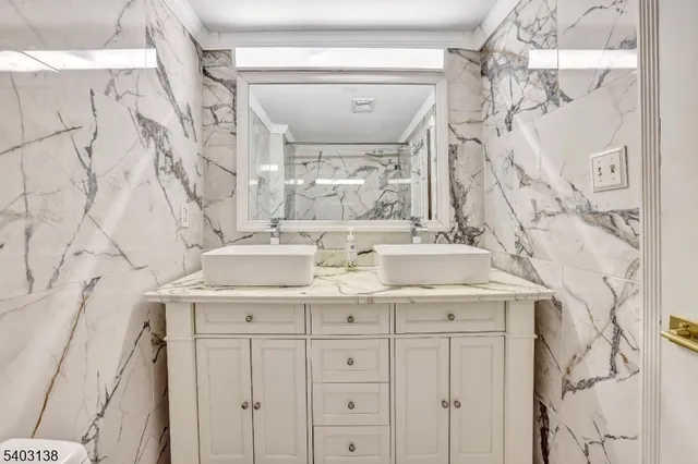 a bathroom with a sink vanity and a mirror