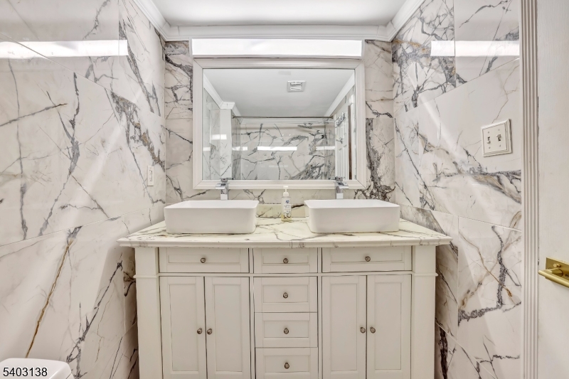 1475 Mt Holly Road, Unit 4 Edgewater Park, NJ 08010 - Photo 14 of 18 a bathroom with a sink vanity and a mirror