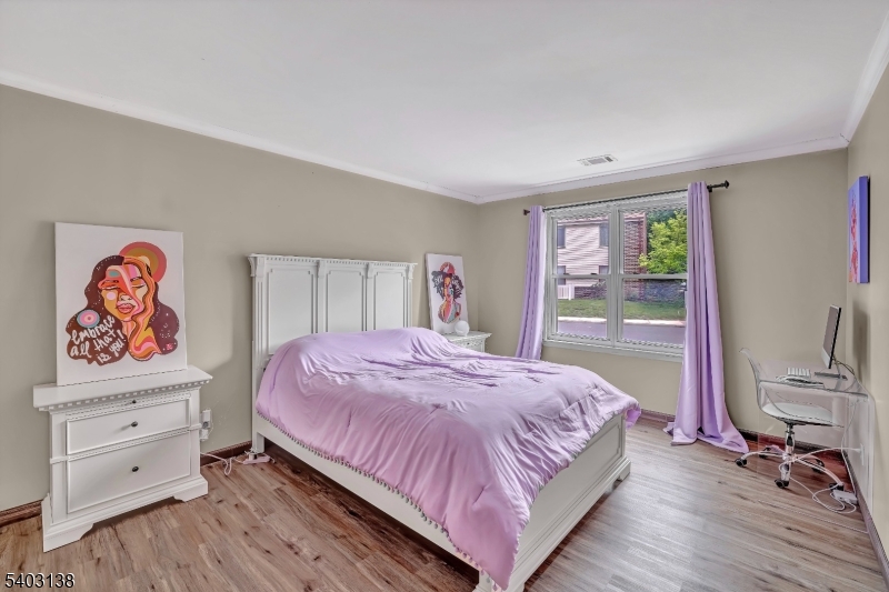 1475 Mt Holly Road, Unit 4 Edgewater Park, NJ 08010 - Photo 15 of 18 a bedroom with a bed and a dresser next to a window