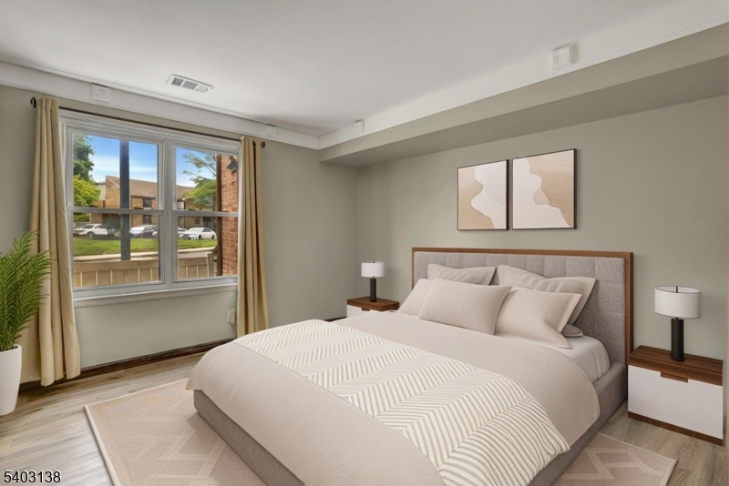 1475 Mt Holly Road, Unit 4 Edgewater Park, NJ 08010 - Photo 17 of 18 a bedroom with a large bed and a large window