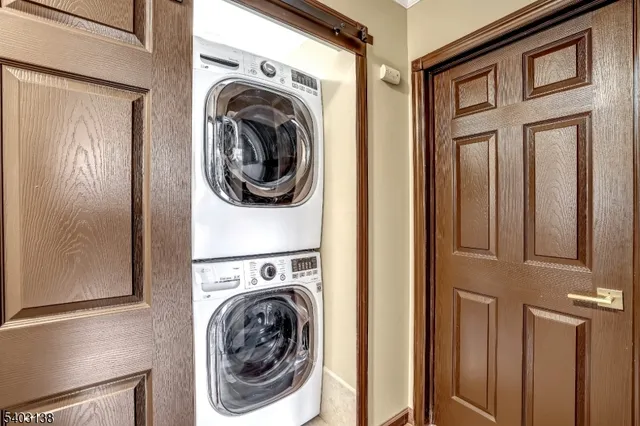 a view of a hallway with washer and dryer