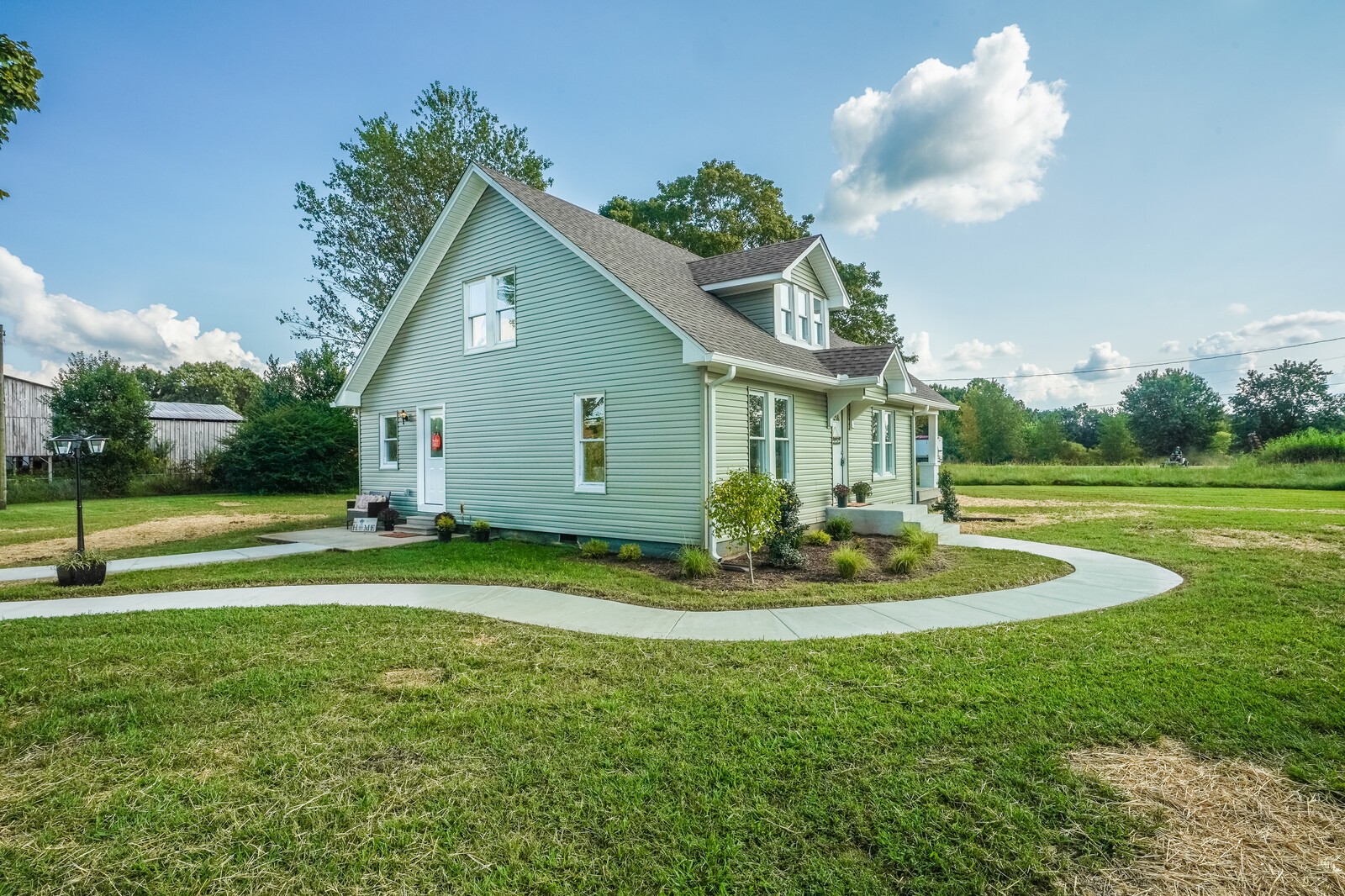 150 Absher Road Portland, TN 37148 - Photo 27 of 37 a front view of a house with a yard and garage