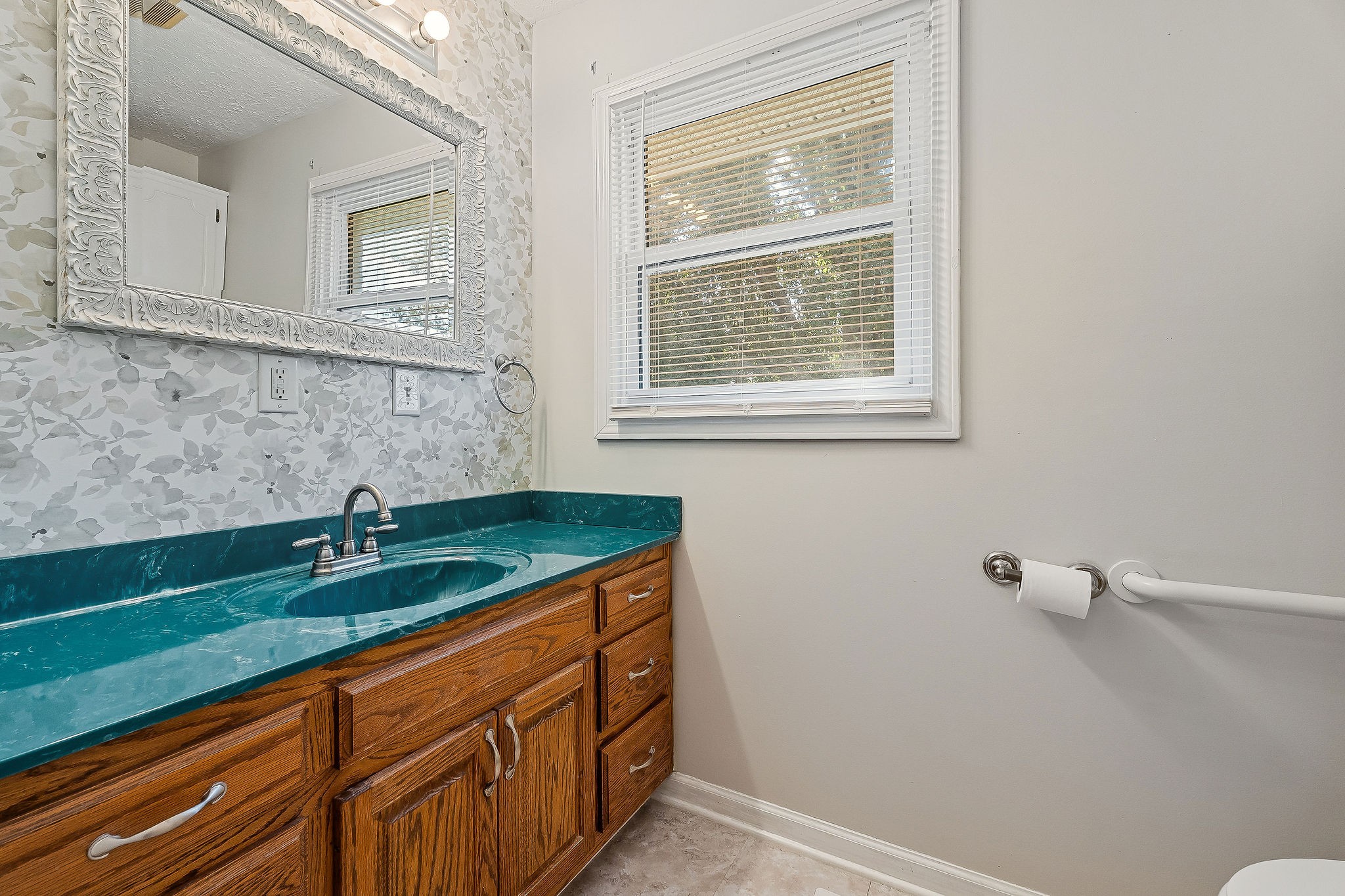 609 Dry Creek Road Smithville, TN 37166 - Photo 12 of 20 a bathroom with a granite countertop sink and mirror