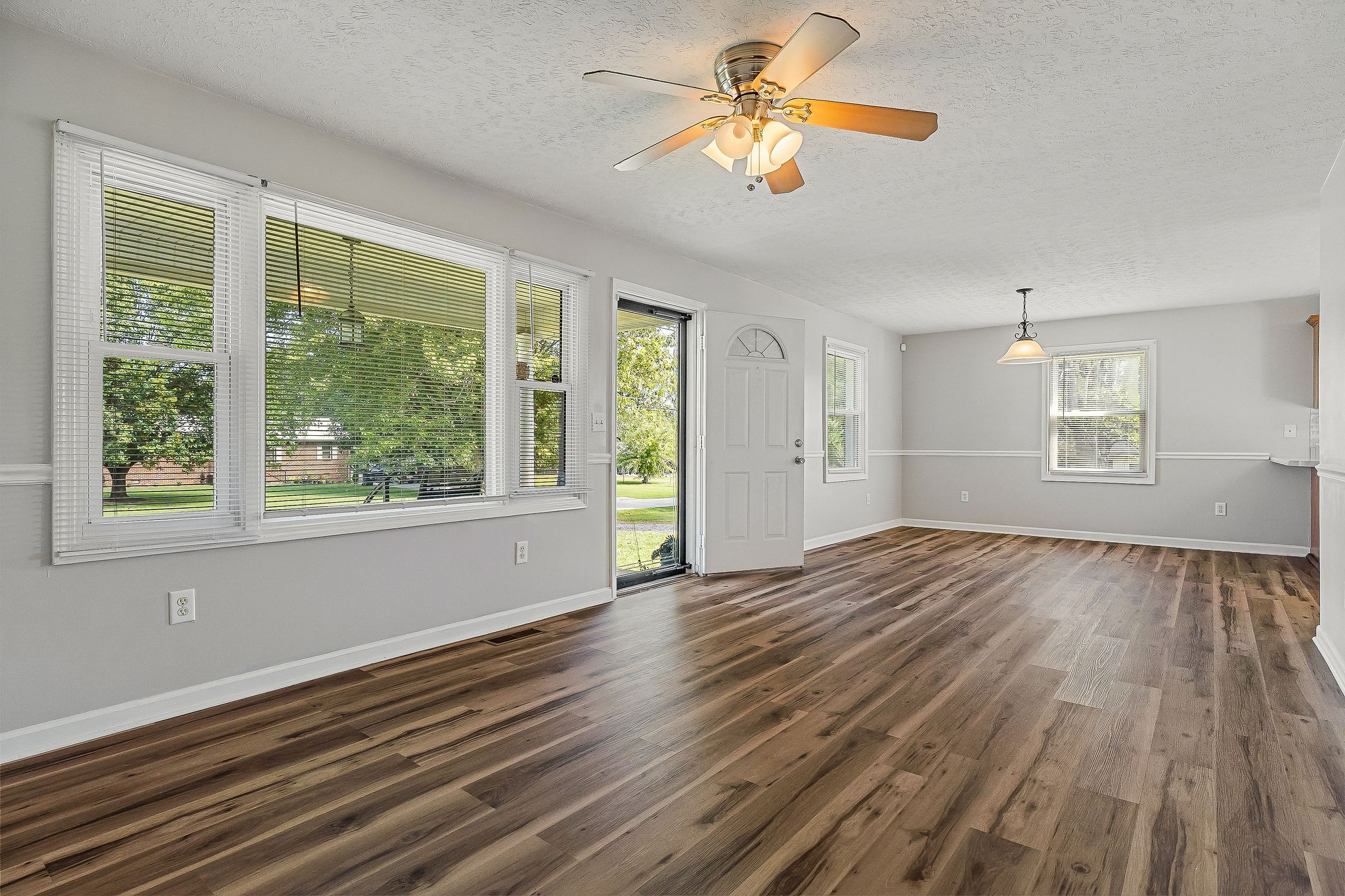 609 Dry Creek Road Smithville, TN 37166 - Photo 5 of 20 a view of empty room with wooden floor and fan