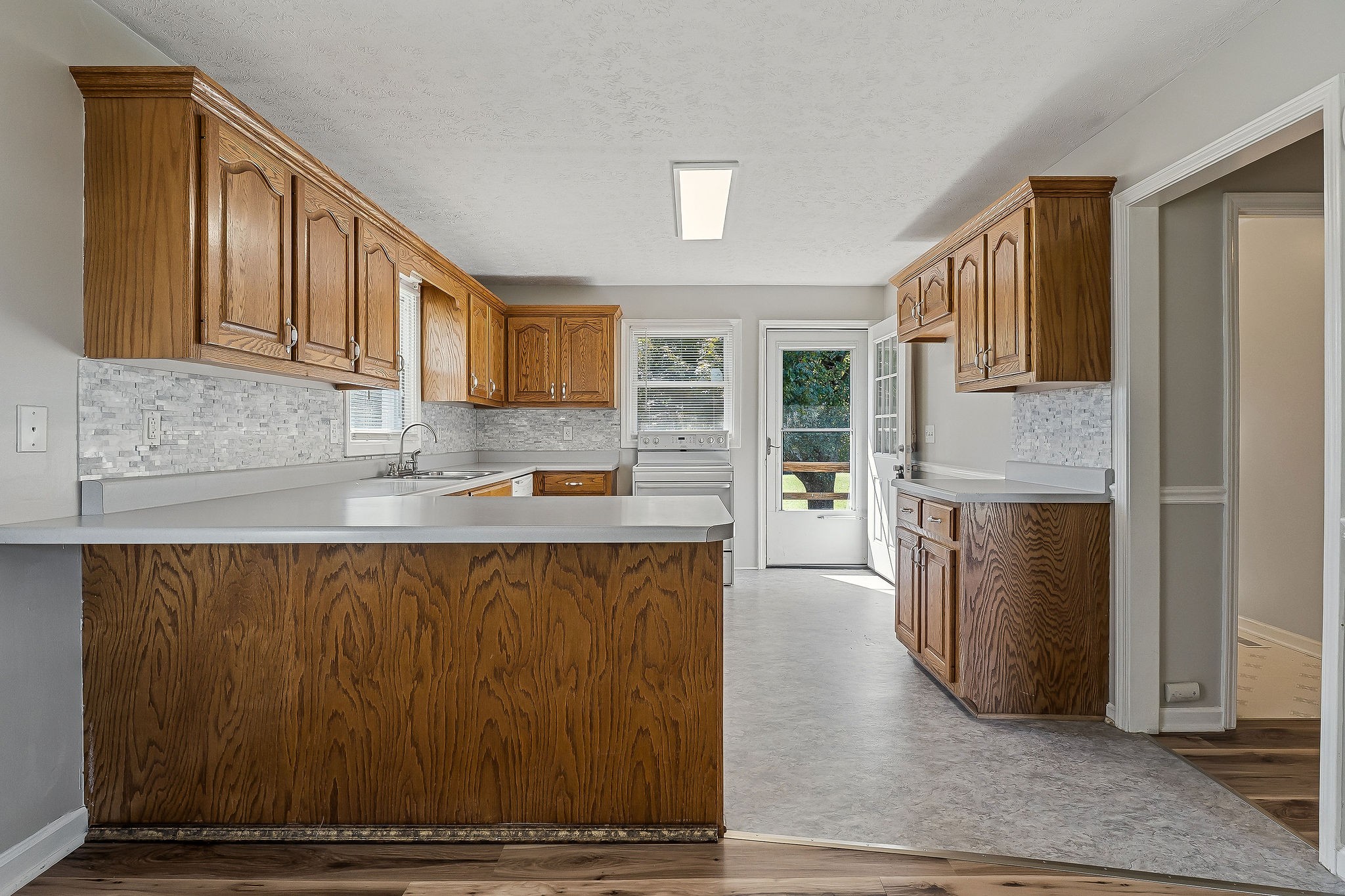609 Dry Creek Road Smithville, TN 37166 - Photo 6 of 20 a kitchen with a refrigerator and wooden cabinets