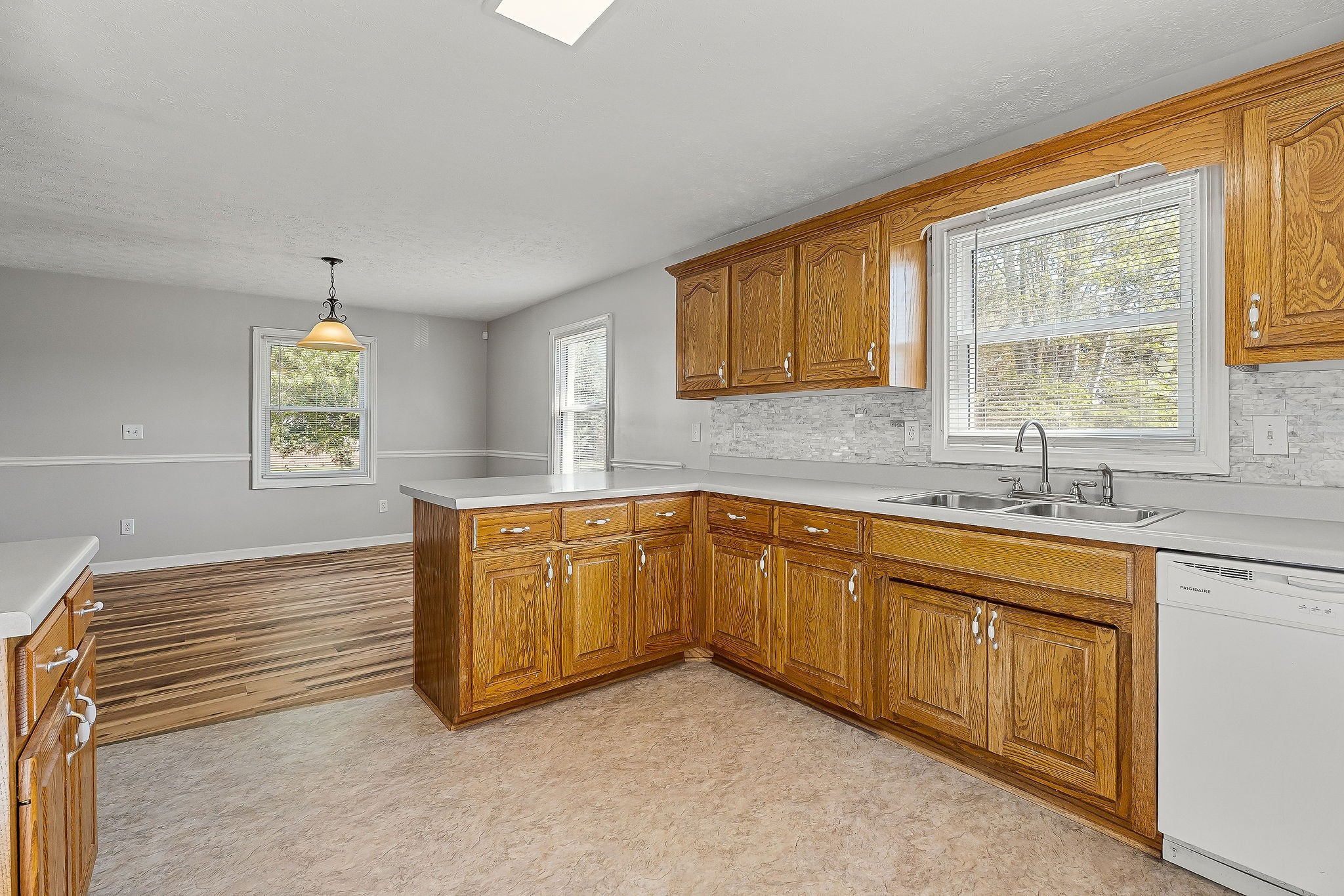 609 Dry Creek Road Smithville, TN 37166 - Photo 8 of 20 a kitchen with granite countertop cabinets stainless steel appliances a sink and a window