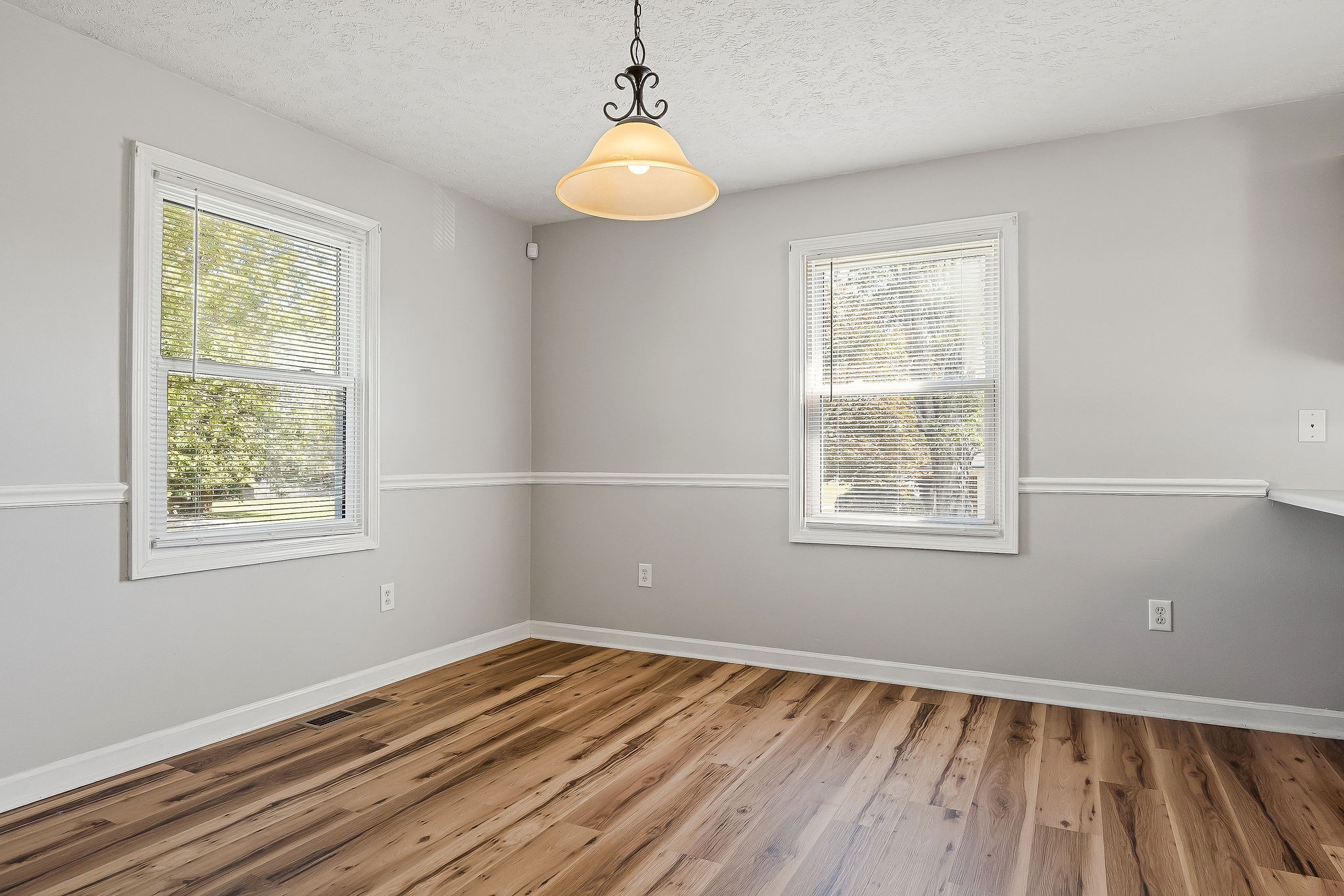 609 Dry Creek Road Smithville, TN 37166 - Photo 10 of 20 a view of an empty room with wooden floor and a window