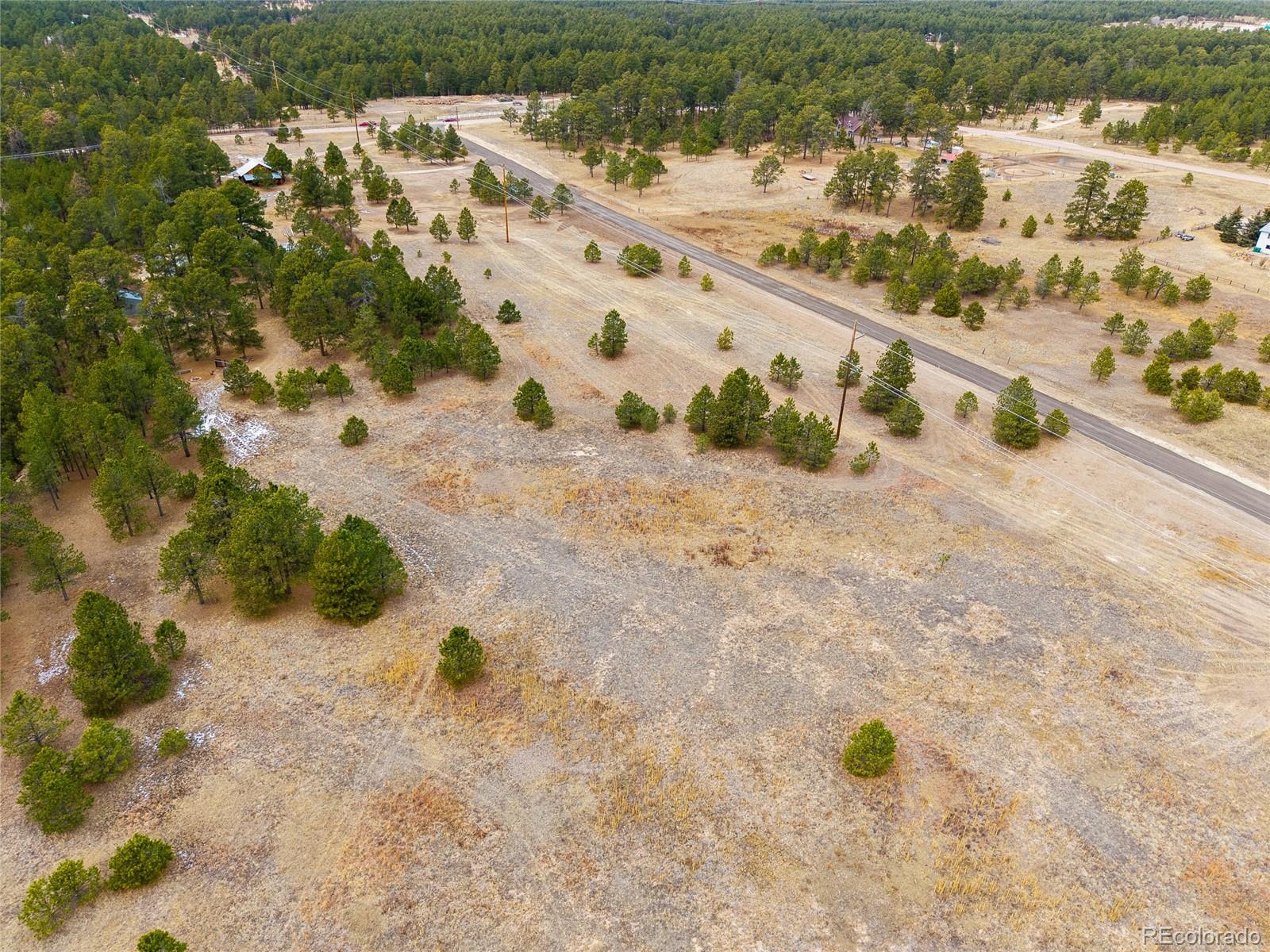 12015 Grandin Elbert, CO 80106 - Photo 4 of 4 a view of a backyard of a house with a yard