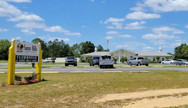 a view of a fountain in front of a house