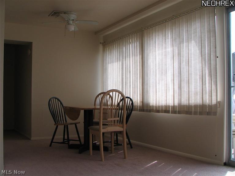 6640 Pearl Road, Unit 710 Cleveland, OH 44130 - Photo 5 of 7 Plenty of room for a table and chairs for entertaining. Open the blinds for some afternoon sun.