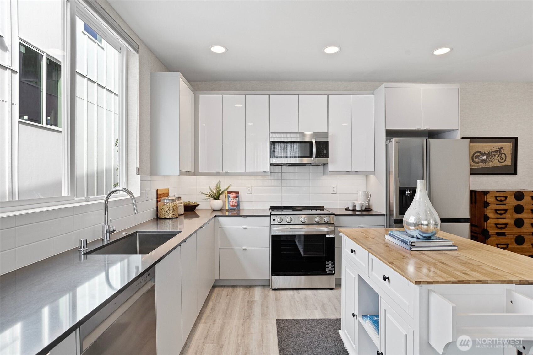 2529 29th Avenue South, Unit A Seattle, WA 98144 - Photo 12 of 21 a kitchen with a sink stove top oven and refrigerator