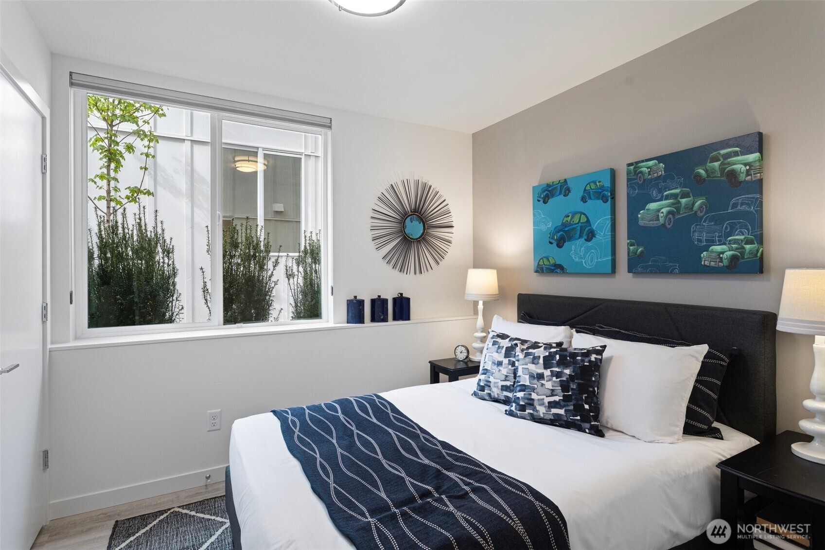 2529 29th Avenue South, Unit A Seattle, WA 98144 - Photo 2 of 21 a bedroom with a bed and a large window