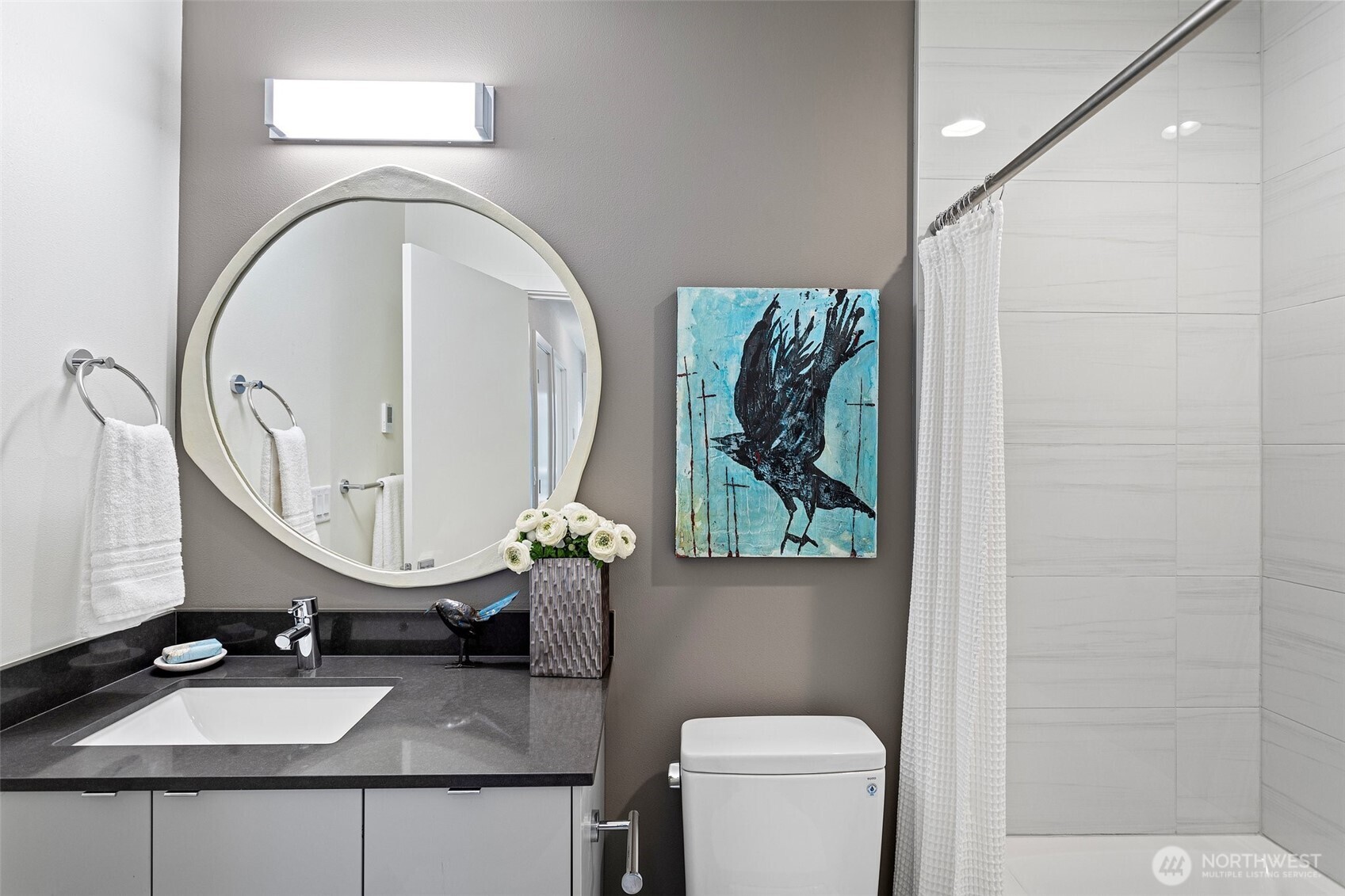 2529 29th Avenue South, Unit A Seattle, WA 98144 - Photo 4 of 21 a bathroom with a toilet sink vanity mirror and vanity