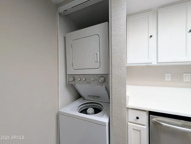 a utility room with a sink washer and dryer