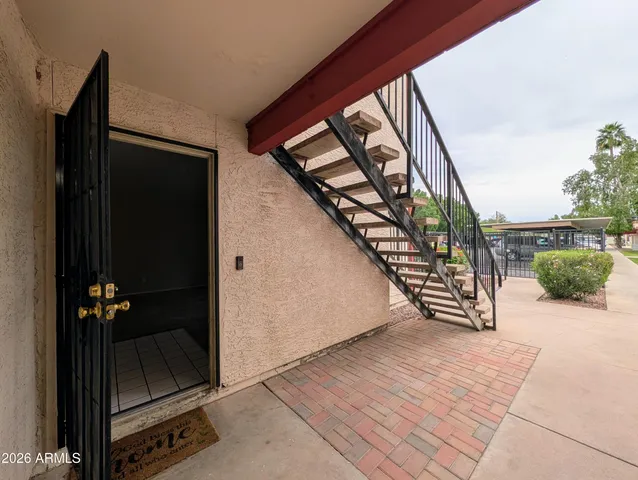a view of an entryway with wooden floor