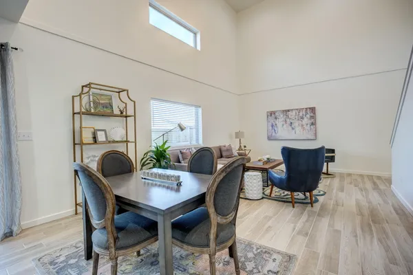 a kitchen with stainless steel appliances kitchen island granite countertop a stove a sink and a refrigerator