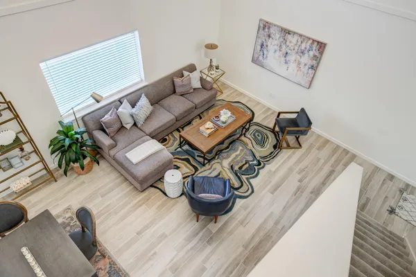 a view of room with furniture and wooden floor