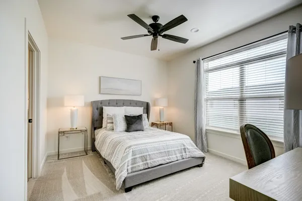 a bathroom with a tub sink and shower curtain