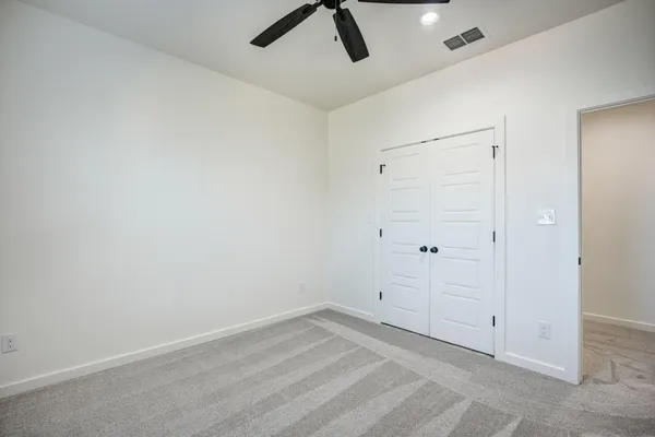 a view of a backyard with pathway