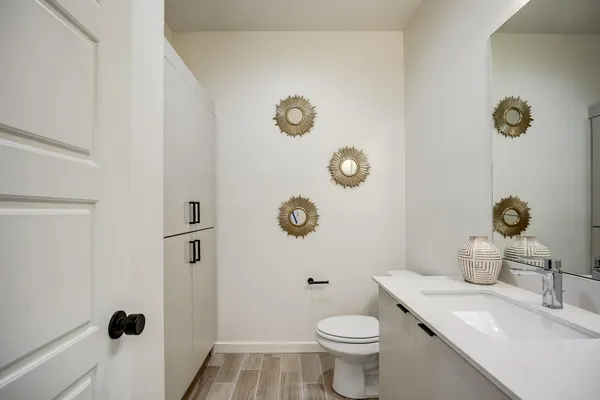 a hallway with two couches and a lamp on a table