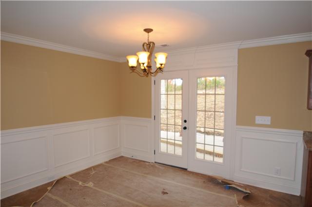 123 Legends Ridge Drive, Unit 12 Lebanon, TN 37090 - Photo 3 of 13 Formal Dining Room with extensive custom trim and double doors leading to covered patio.