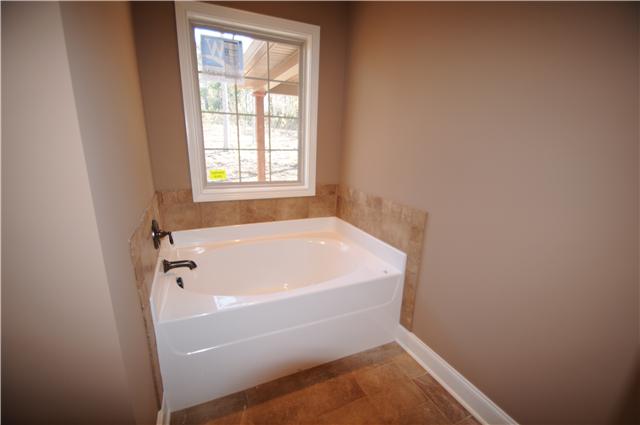 123 Legends Ridge Drive, Unit 12 Lebanon, TN 37090 - Photo 8 of 13 Garden tub with tile backsplash.