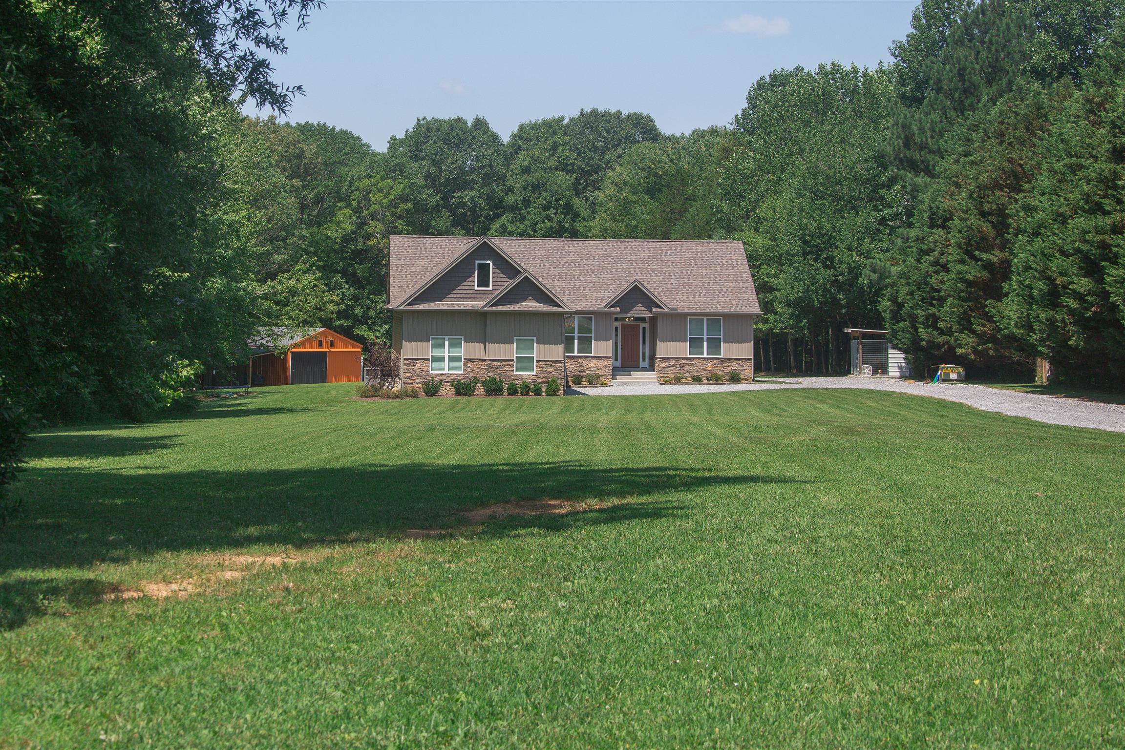 1045 North Corinth Road Portland, TN 37148 - Photo 2 of 29 a front view of a house with a yard