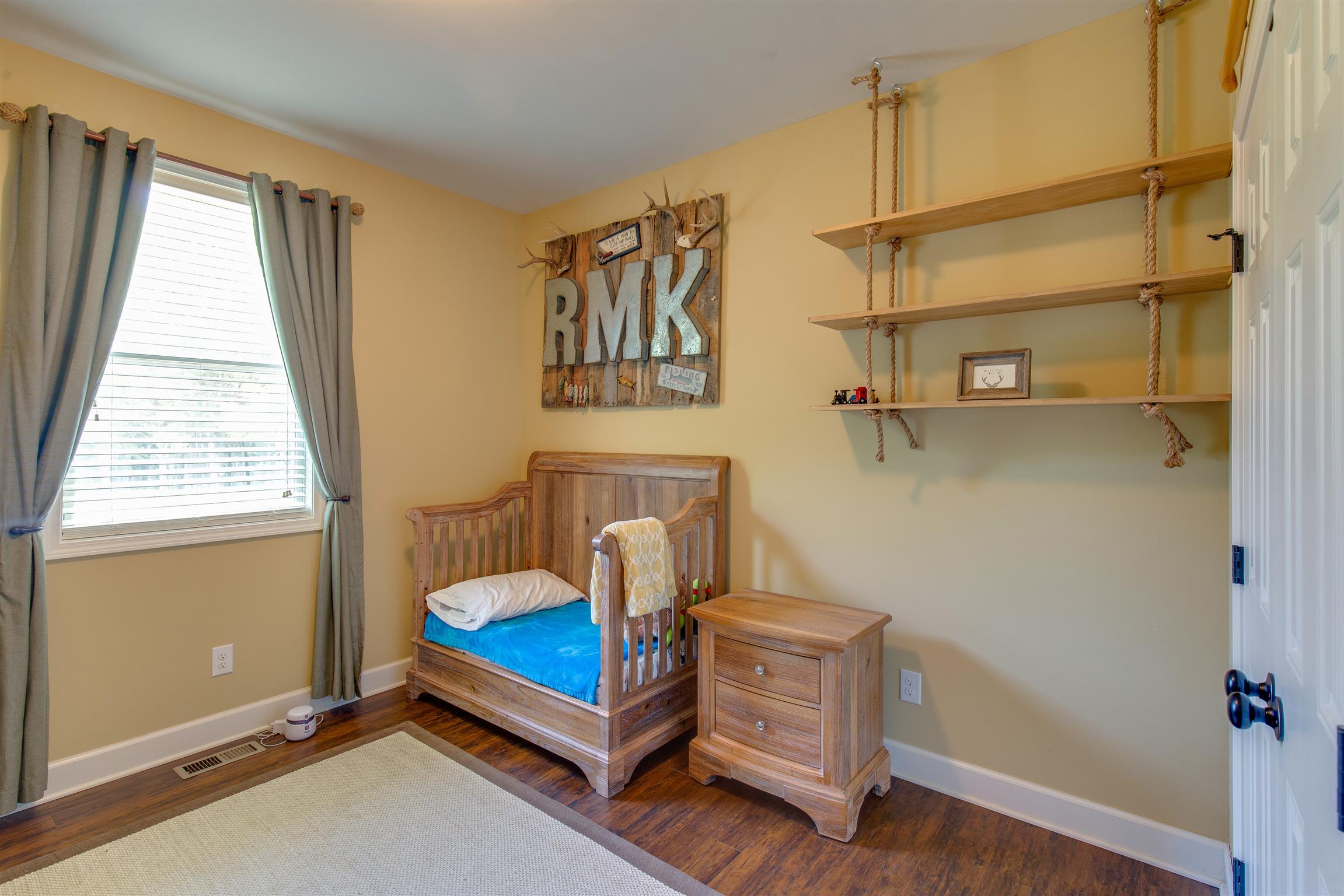 1045 North Corinth Road Portland, TN 37148 - Photo 16 of 29 a bedroom with a bed and window