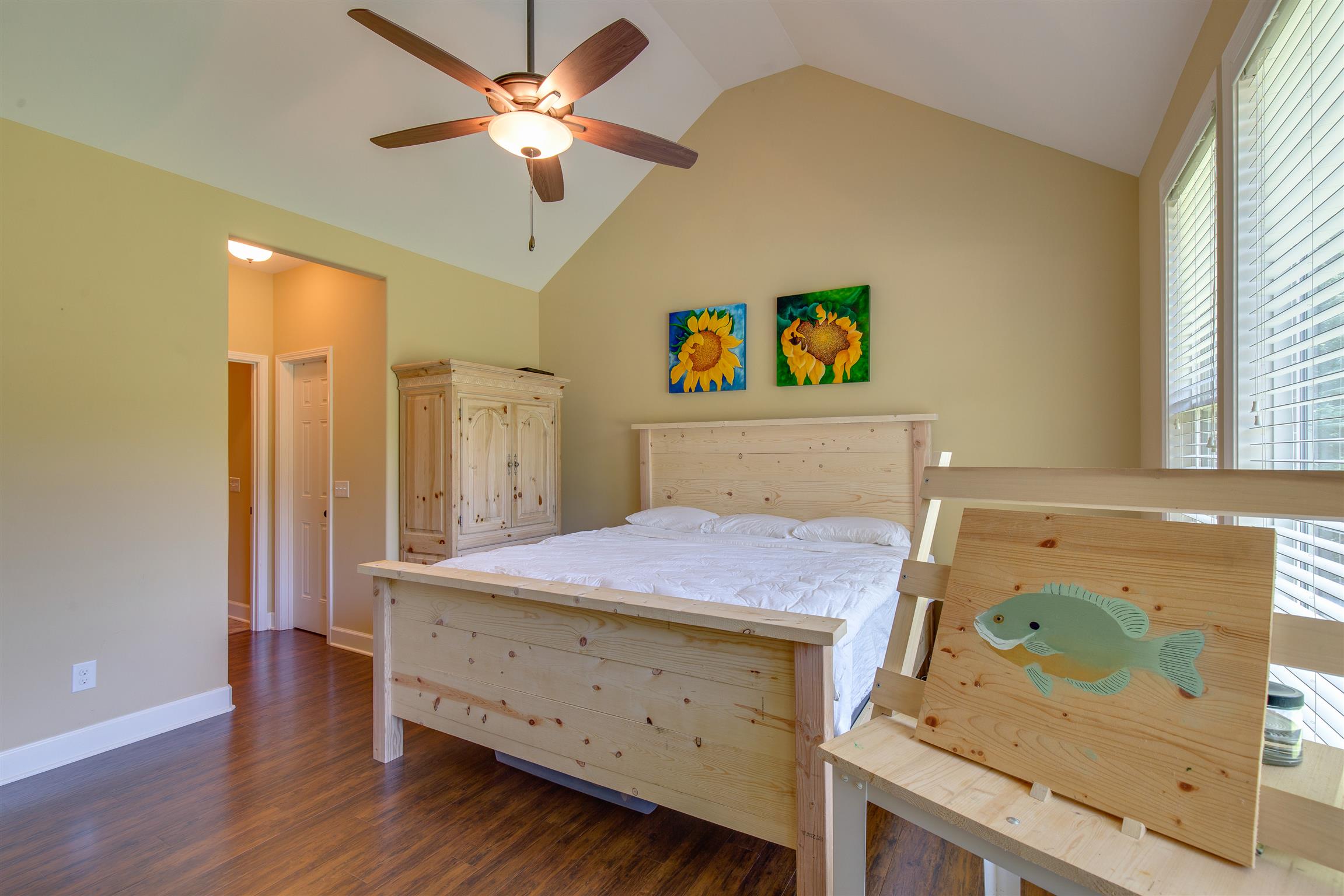 1045 North Corinth Road Portland, TN 37148 - Photo 19 of 29 a bedroom with a bed and a chandelier