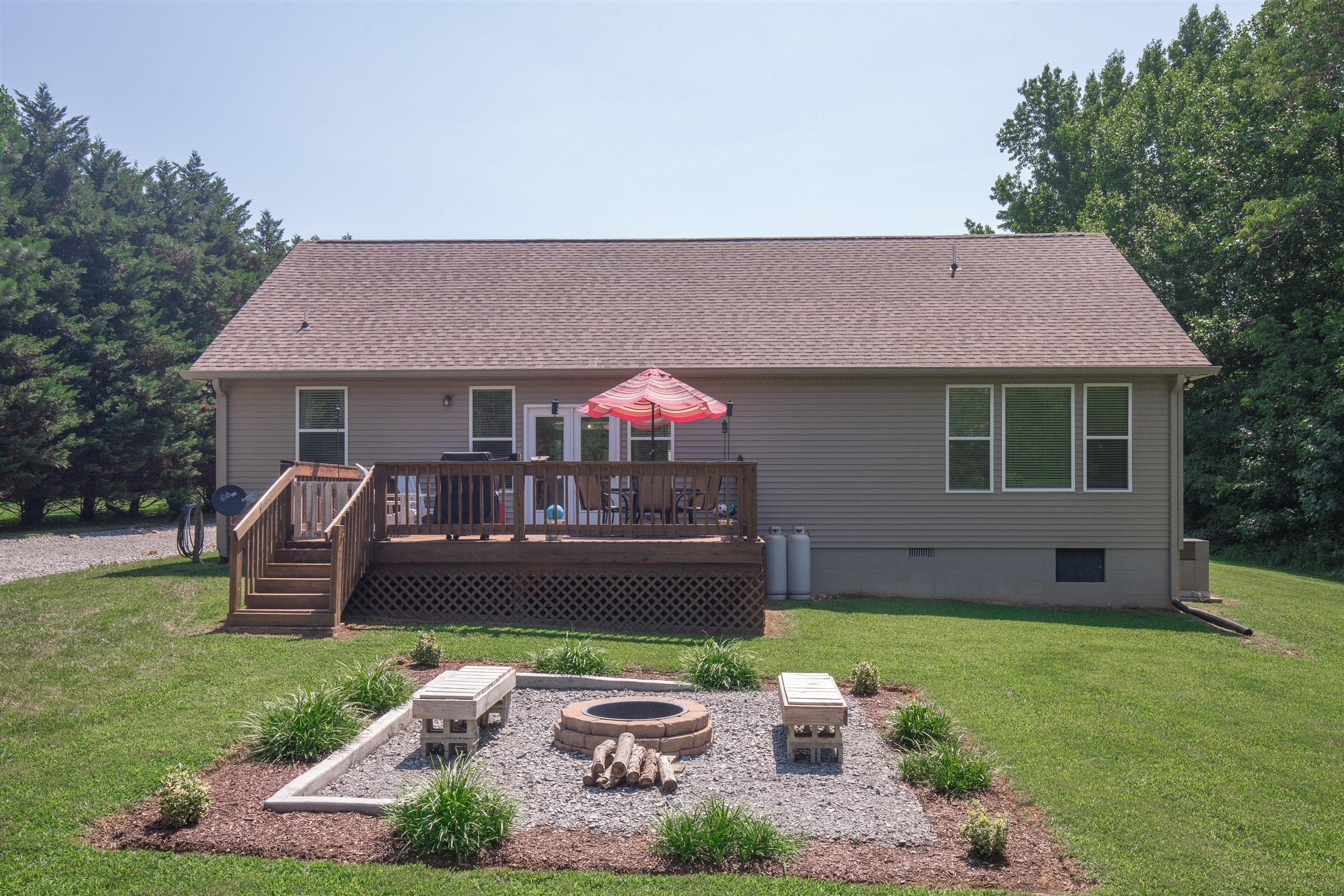 1045 North Corinth Road Portland, TN 37148 - Photo 26 of 29 a front view of a house with a garden