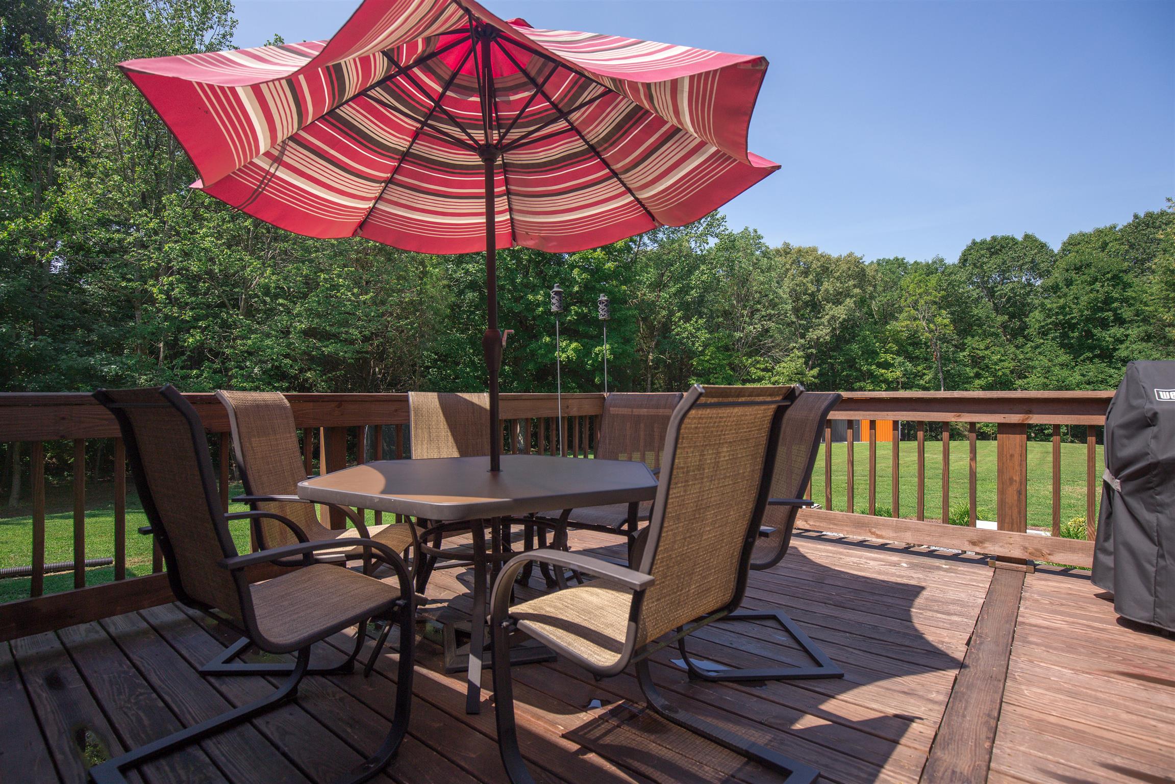 1045 North Corinth Road Portland, TN 37148 - Photo 29 of 29 a view of a roof deck with chair and wooden floor