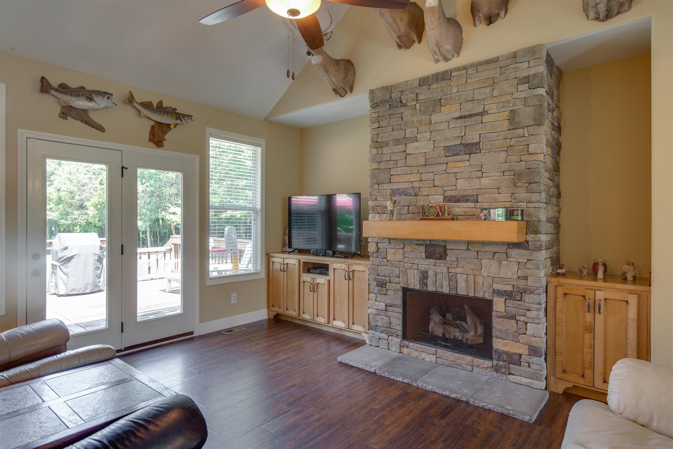 1045 North Corinth Road Portland, TN 37148 - Photo 7 of 29 a living room with furniture and a fireplace