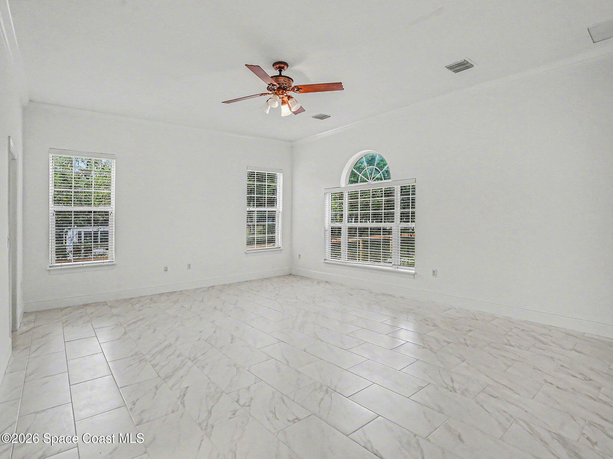 11940 Kirby Smith Road Orlando, FL 32832 - Photo 12 of 39 a view of an empty room with a window