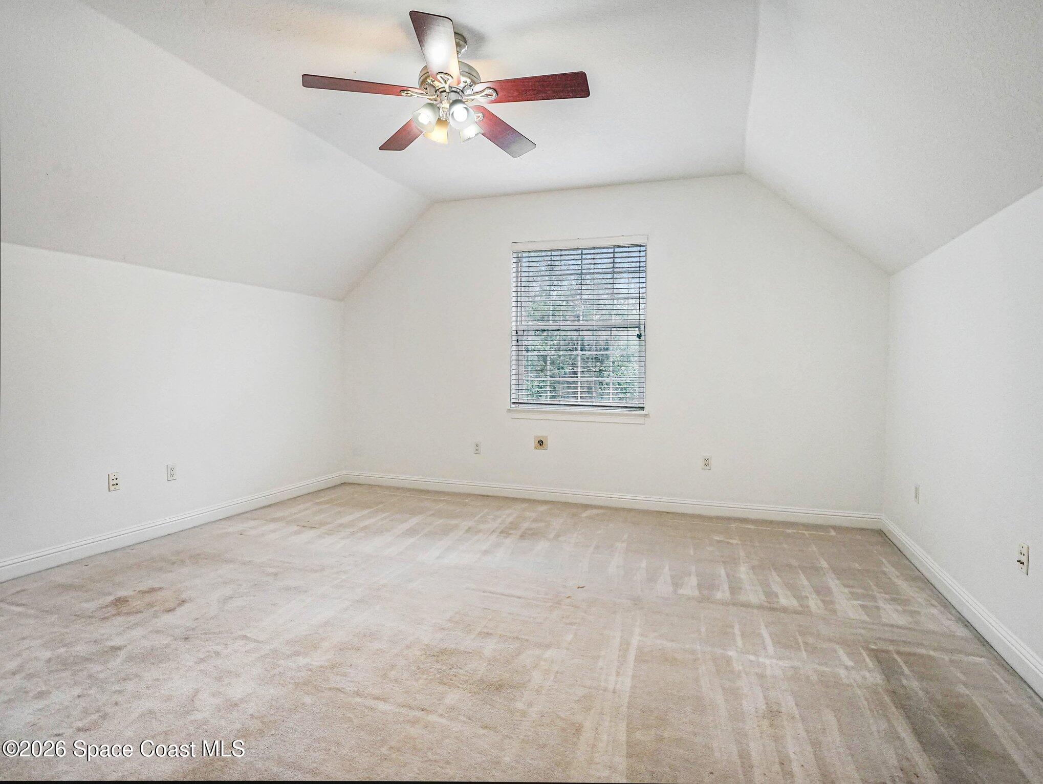 11940 Kirby Smith Road Orlando, FL 32832 - Photo 16 of 39 wooden floor in an empty room with a window