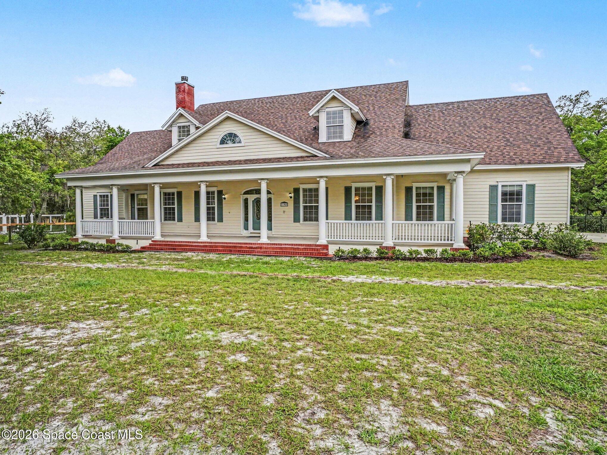 11940 Kirby Smith Road Orlando, FL 32832 - Photo 28 of 39 a front view of a house with garden